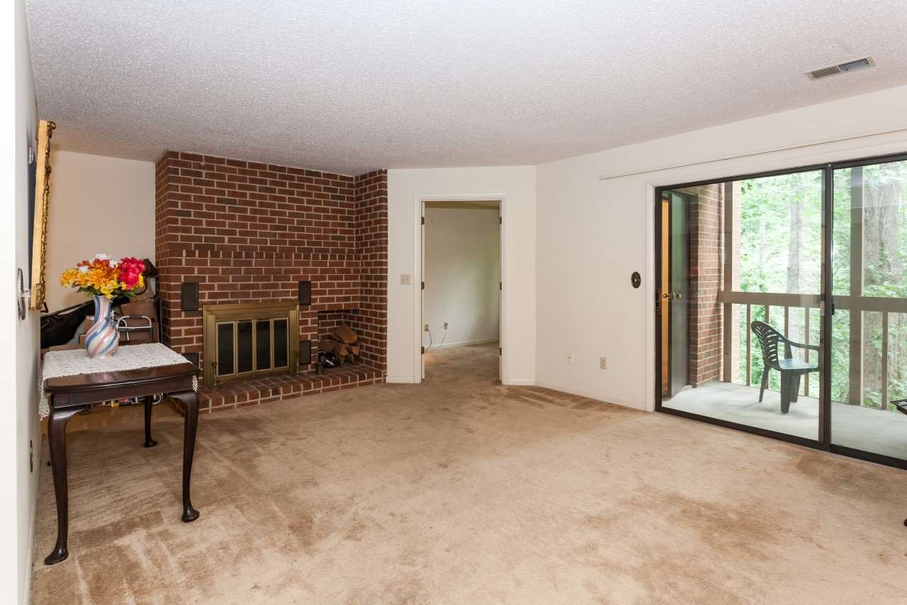 113 Turtle Creek Road, Unit 7 Charlottesville, VA 22901 - Photo 8 of 32 a view of a livingroom with a fireplace and workspace