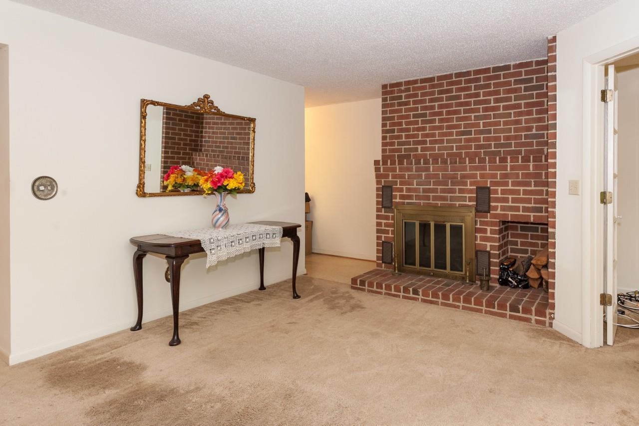 113 Turtle Creek Road, Unit 7 Charlottesville, VA 22901 - Photo 9 of 32 a living room with furniture and a fireplace