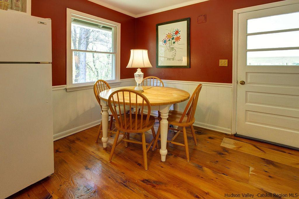 705 Henry Williams Road Roxbury, NY 12474 - Photo 14 of 34 a dining room with furniture window wooden floor