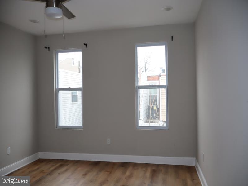 2212 Morris Street Philadelphia, PA 19145 - Photo 12 of 14 a view of a room with wooden floor and windows