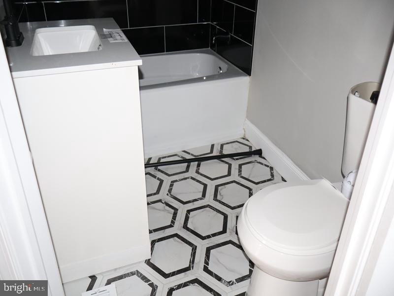 2212 Morris Street Philadelphia, PA 19145 - Photo 13 of 14 a utility room with dryer and washer