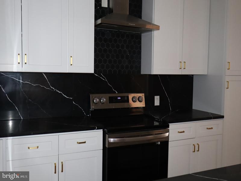 2212 Morris Street Philadelphia, PA 19145 - Photo 8 of 14 a kitchen with a sink and cabinets