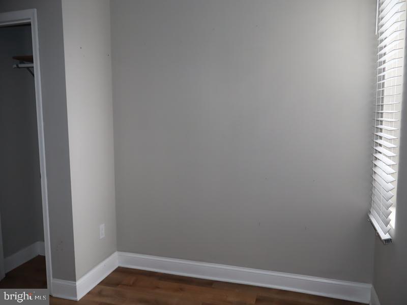 2212 Morris Street Philadelphia, PA 19145 - Photo 10 of 14 a view of a small space with wooden floor and a window