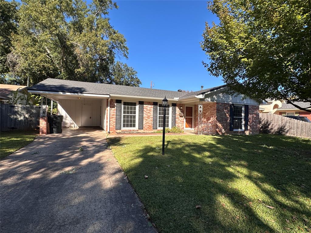 334 Wayne Drive Shreveport, LA 71105 - Photo 1 of 1 a front view of a house with a garden