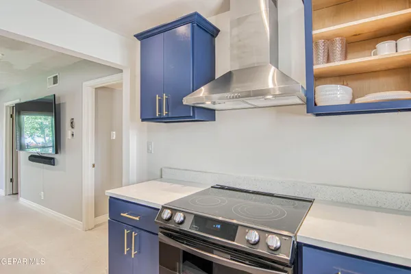 a kitchen with a stove and a microwave