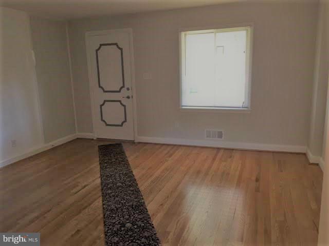 362 Grovethorn Road Baltimore, MD 21220 - Photo 2 of 14 a view of a room with wooden floor and windows