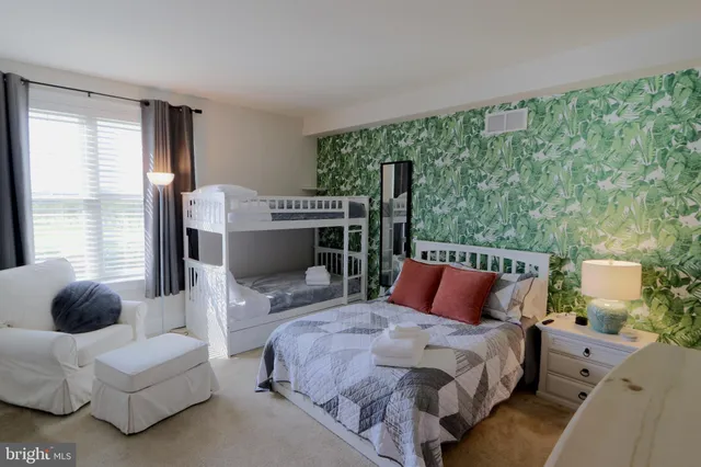 a bedroom with a bed and a couch