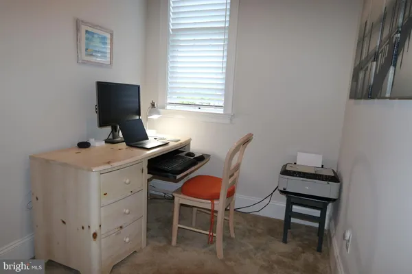 a view of a workspace with furniture