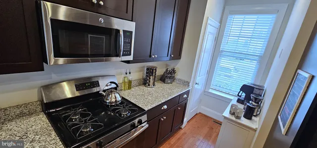 a kitchen with a stove and a microwave