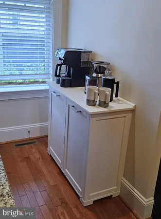a kitchen with a stove and a refrigerator