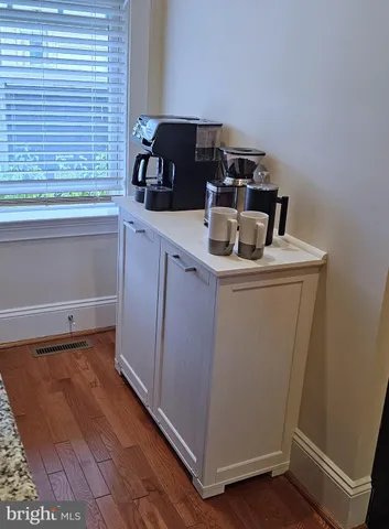 a kitchen with a stove and a refrigerator