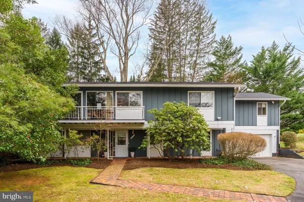 front view of a house with a swimming pool