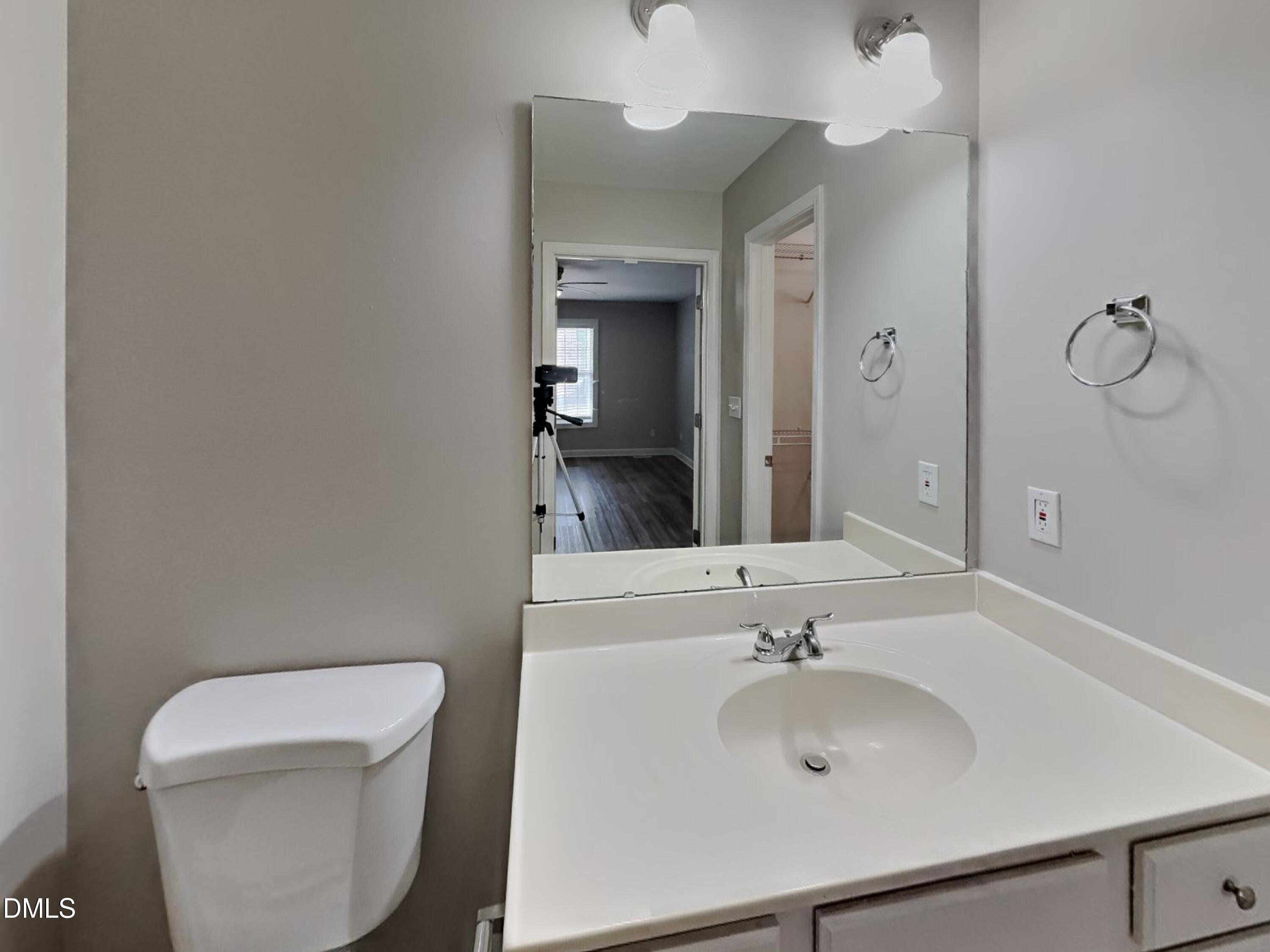 3224 Cotton Grove Raleigh, NC 27610 - Photo 8 of 15 a bathroom with a sink and a toilet