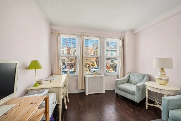 a bedroom with bed and window