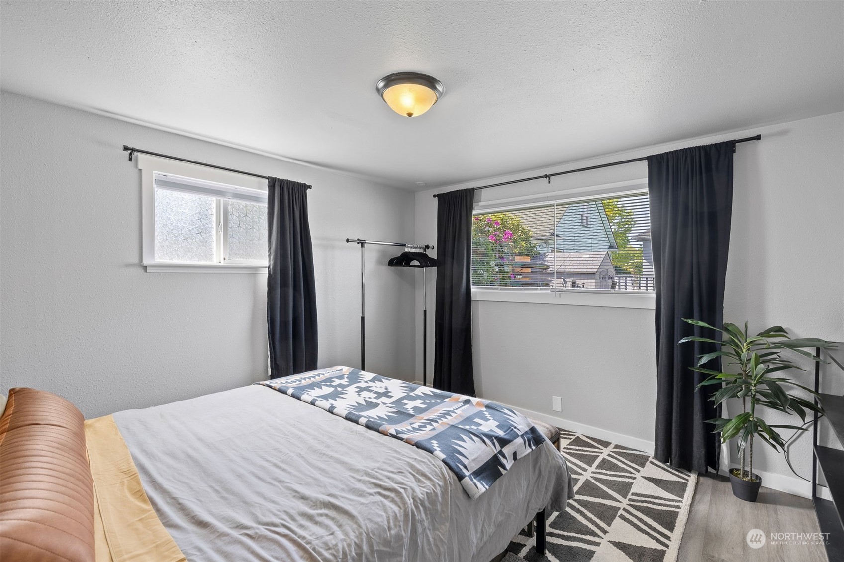 1601 Virginia Avenue Everett, WA 98201 - Photo 20 of 30 a bedroom with a bed and a potted plant