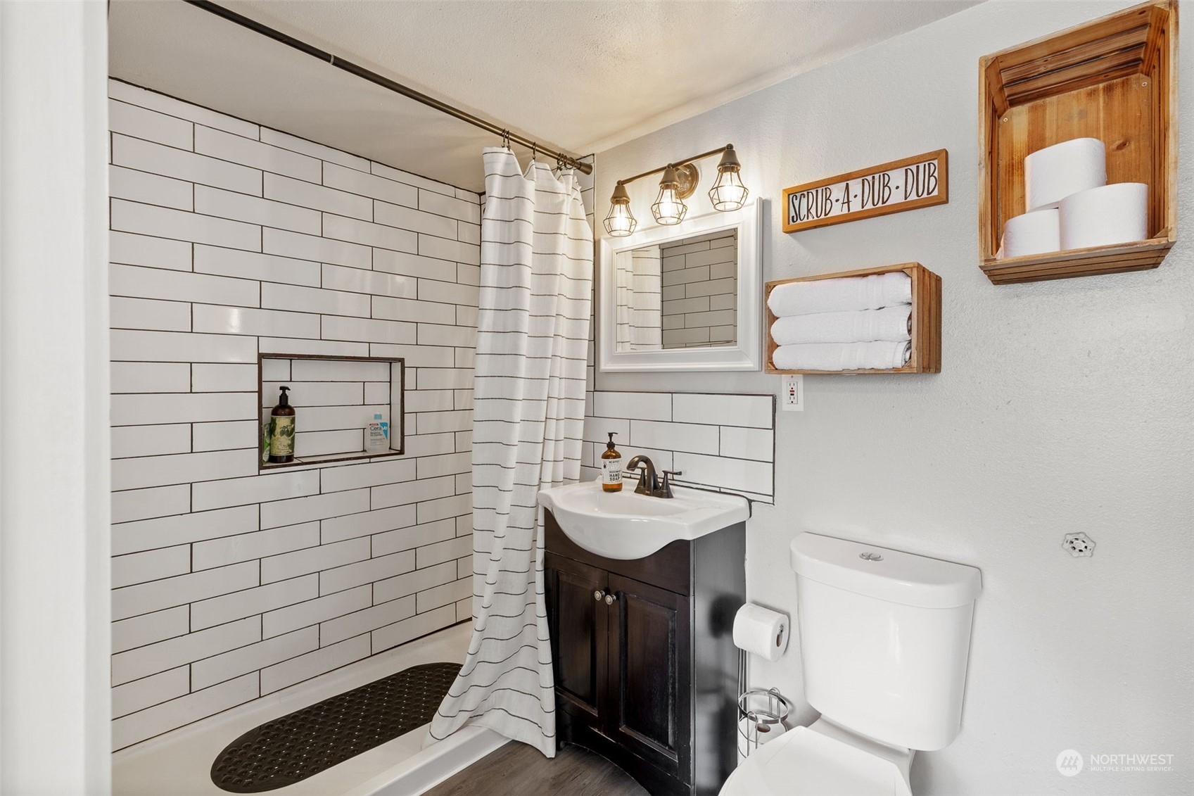 1601 Virginia Avenue Everett, WA 98201 - Photo 22 of 30 a bathroom with a sink a toilet and mirror