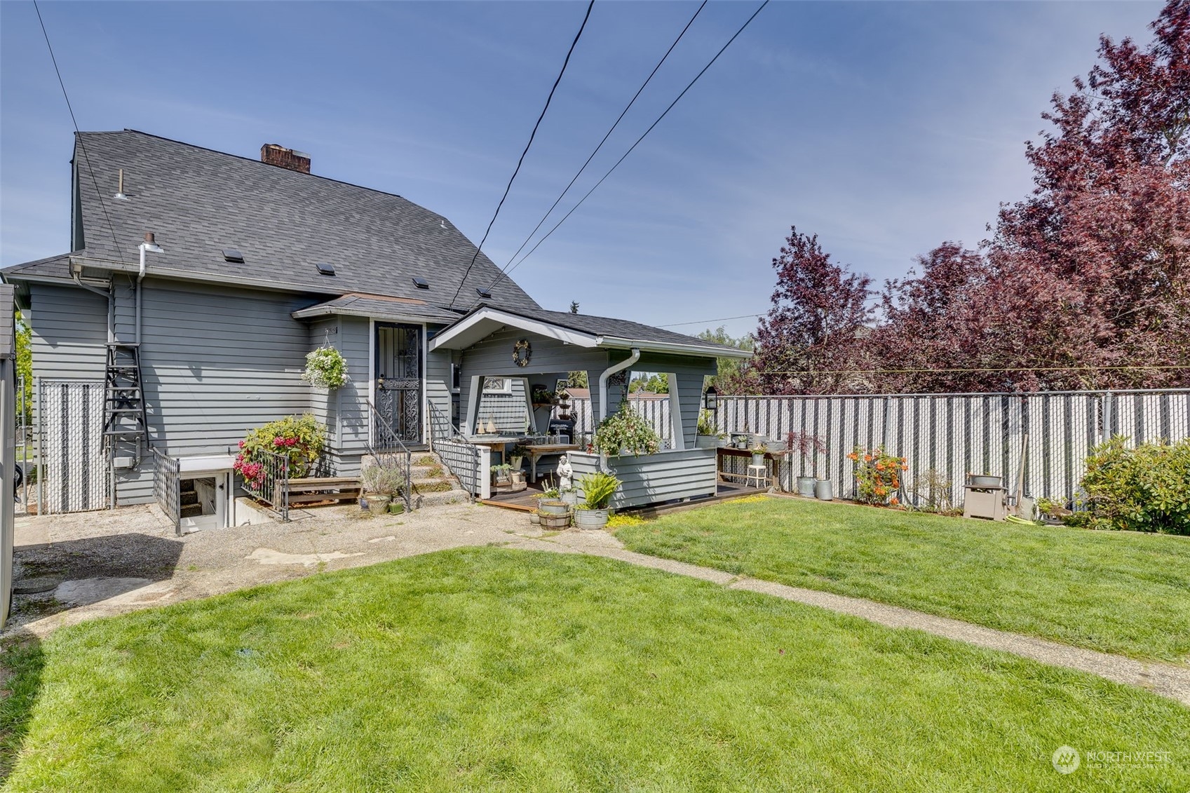 1601 Virginia Avenue Everett, WA 98201 - Photo 24 of 30 a view of a house with backyard porch and sitting area