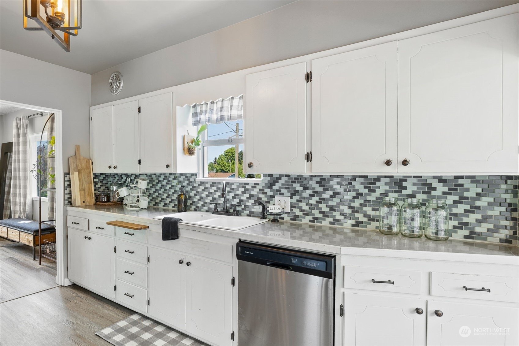 1601 Virginia Avenue Everett, WA 98201 - Photo 7 of 30 a kitchen with granite countertop white cabinets and white appliances
