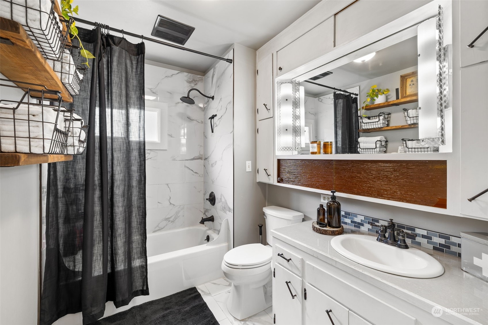 1601 Virginia Avenue Everett, WA 98201 - Photo 9 of 30 a bathroom with a sink a toilet and shower