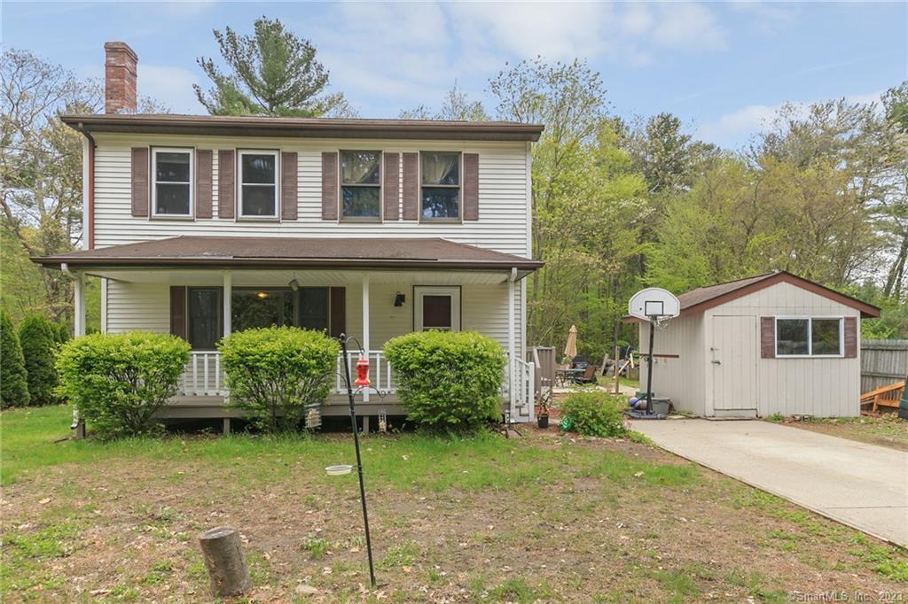 10 North Shore Road Killingly, CT 06241 - Photo 1 of 1 a front view of a house with a yard and potted plants