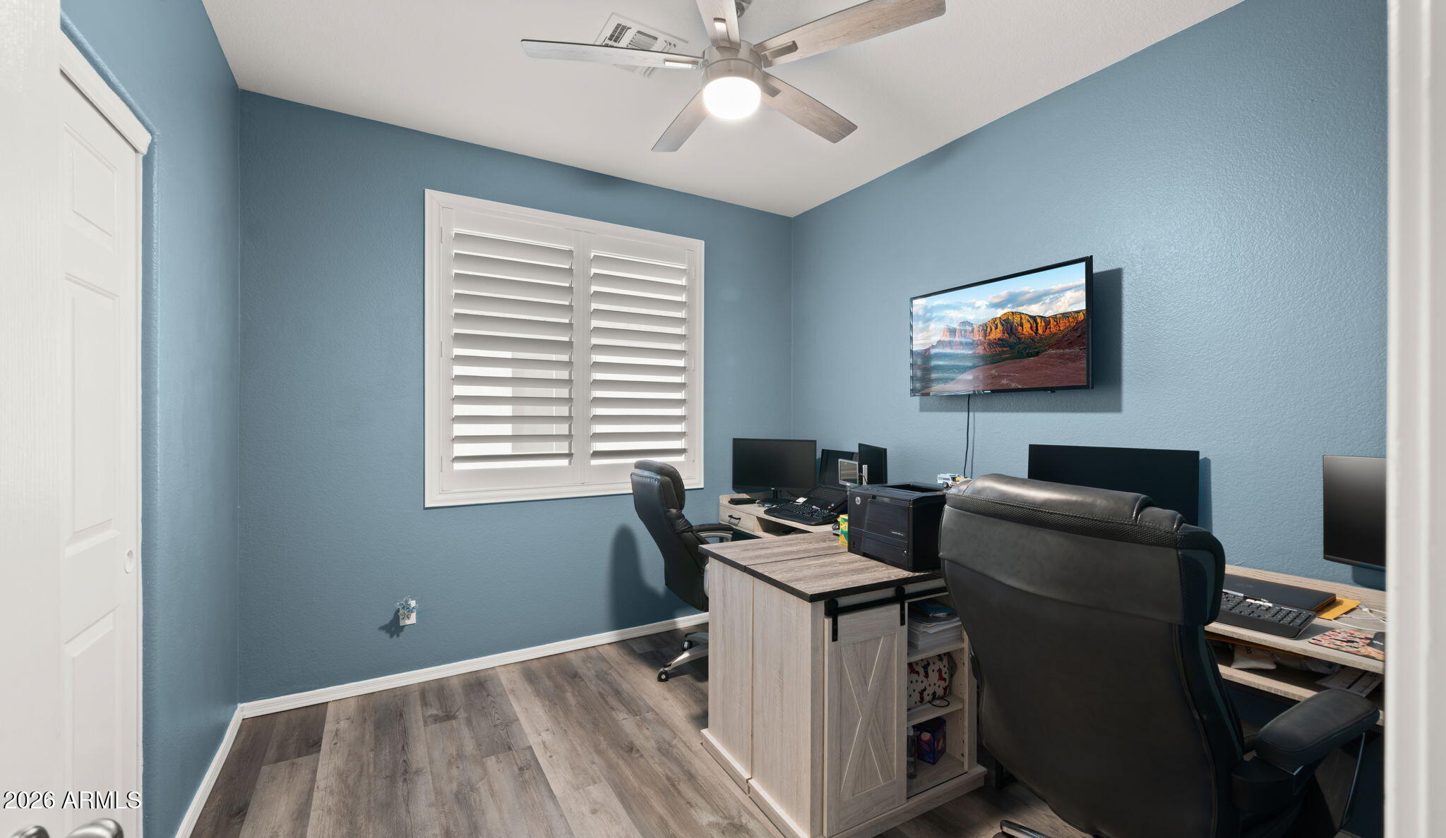 1957 South Talbot Circle Mesa, AZ 85209 - Photo 12 of 35 a work room with furniture and a flat screen tv