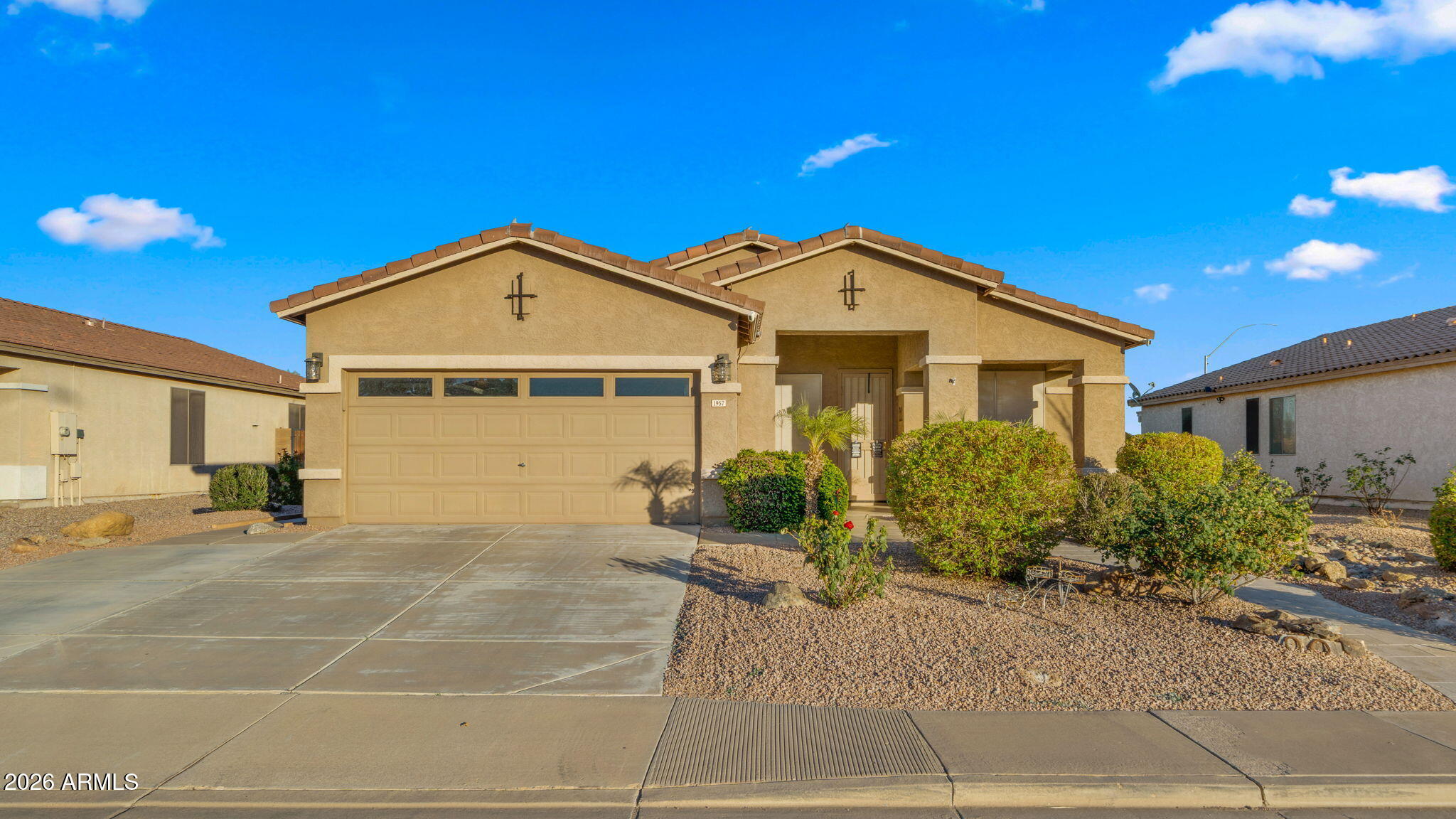 1957 South Talbot Circle Mesa, AZ 85209 - Photo 17 of 35 a front view of a house with a yard and garage