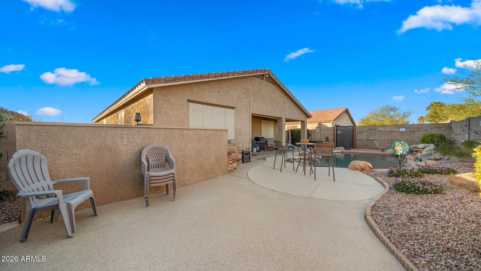 1957 South Talbot Circle Mesa, AZ 85209 - Photo 18 of 35 a view of a patio with a table and chairs and potted plants