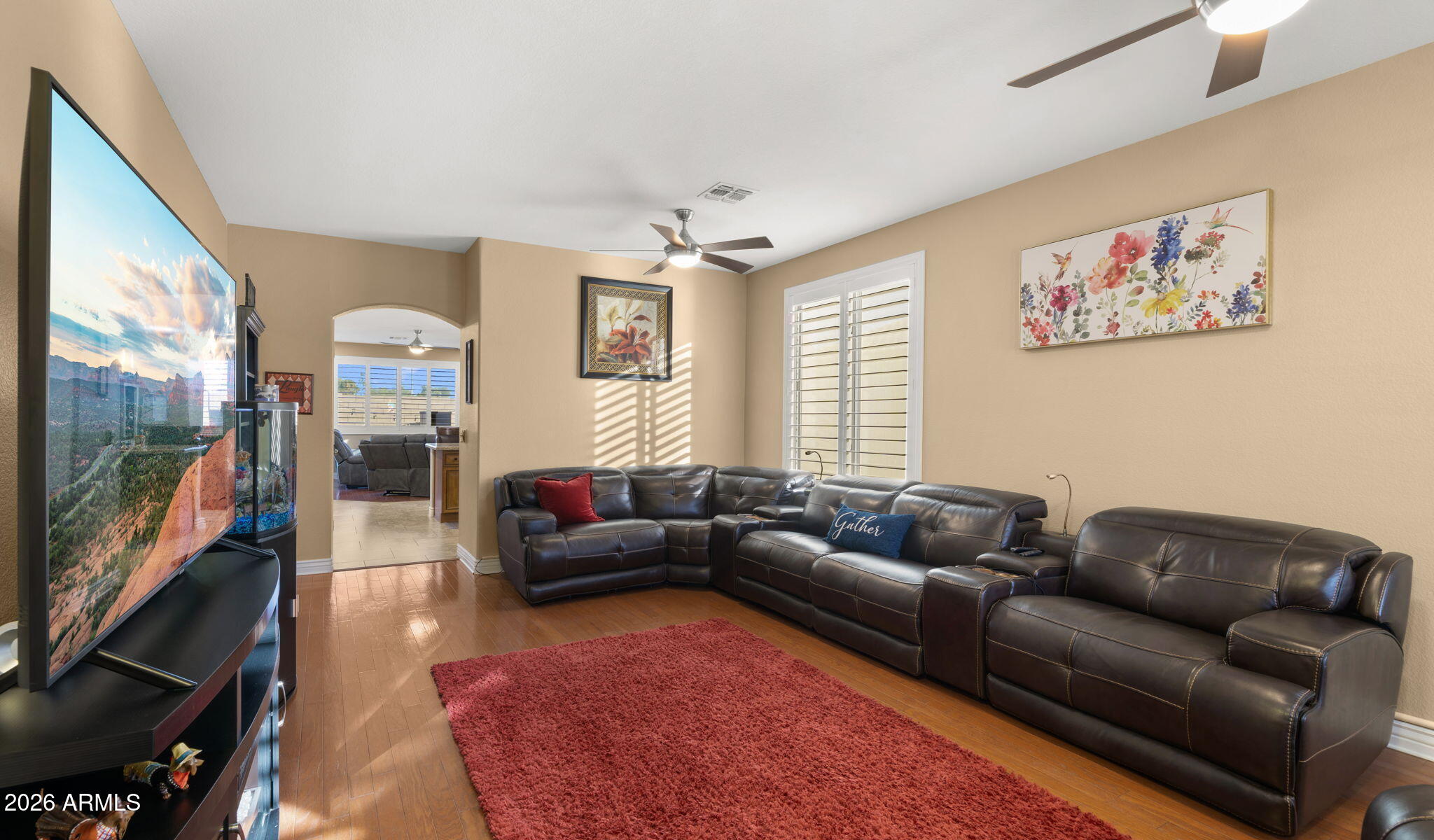 1957 South Talbot Circle Mesa, AZ 85209 - Photo 20 of 35 a living room with furniture and a flat screen tv