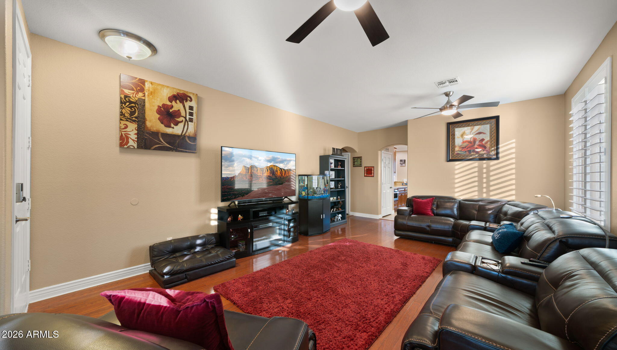 1957 South Talbot Circle Mesa, AZ 85209 - Photo 21 of 35 a living room with furniture and a flat screen tv