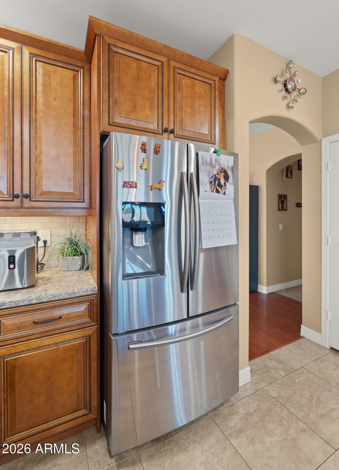 1957 South Talbot Circle Mesa, AZ 85209 - Photo 26 of 35 a kitchen with stainless steel appliances granite countertop a refrigerator a stove and a sink with cabinets