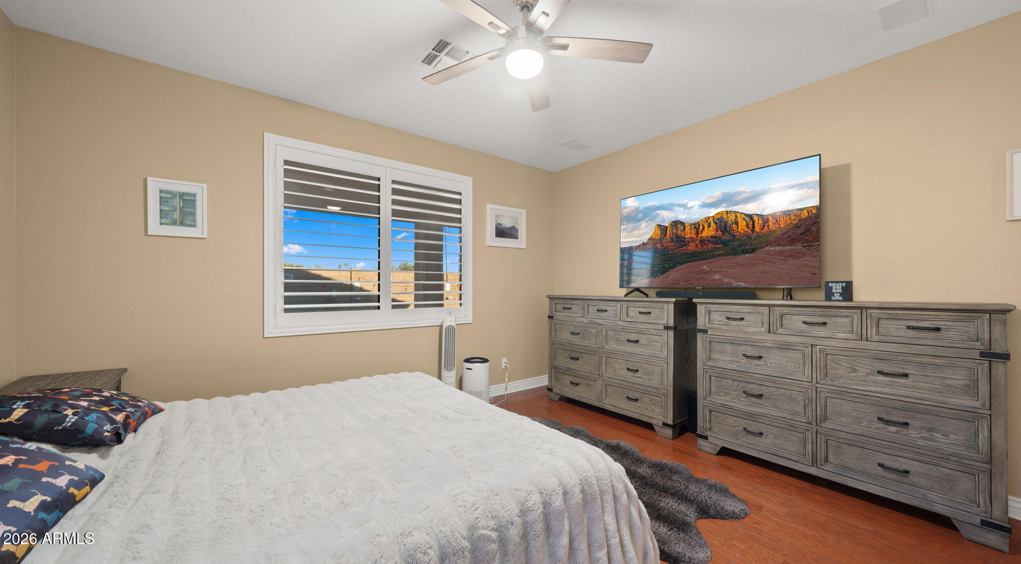 1957 South Talbot Circle Mesa, AZ 85209 - Photo 8 of 35 a bedroom with a bed and a flat screen tv