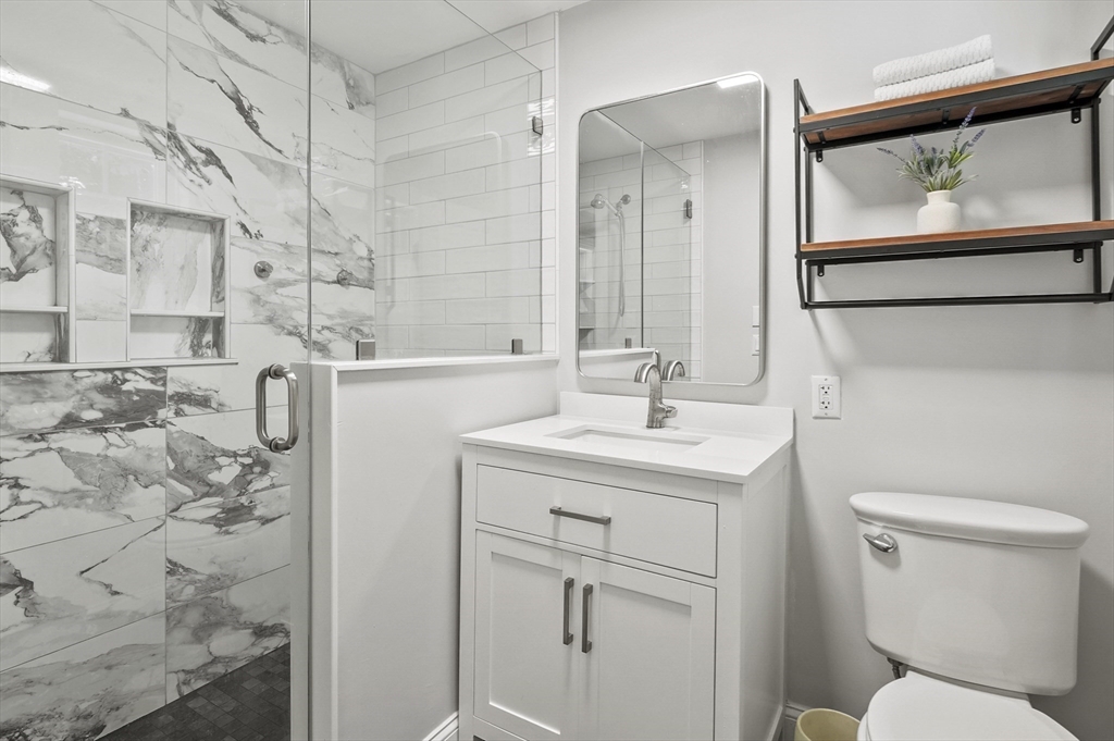 153 Sherbert Road Ashburnham, MA 01430 - Photo 19 of 32 a bathroom with a toilet sink and mirror