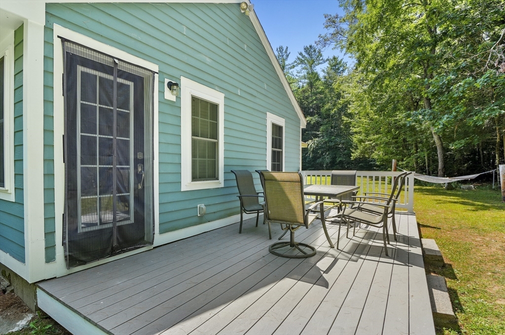 153 Sherbert Road Ashburnham, MA 01430 - Photo 23 of 32 a view of a chairs and table on the wooden deck