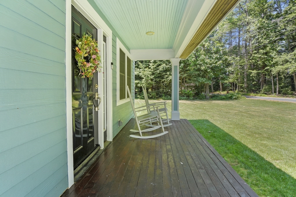 153 Sherbert Road Ashburnham, MA 01430 - Photo 4 of 32 a view of a chair and tables in the balcony