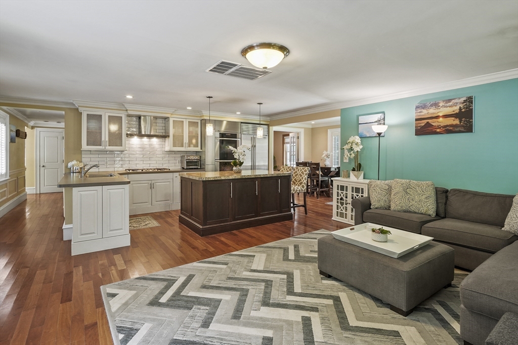 153 Sherbert Road Ashburnham, MA 01430 - Photo 6 of 32 a living room with furniture kitchen view and a wooden floor