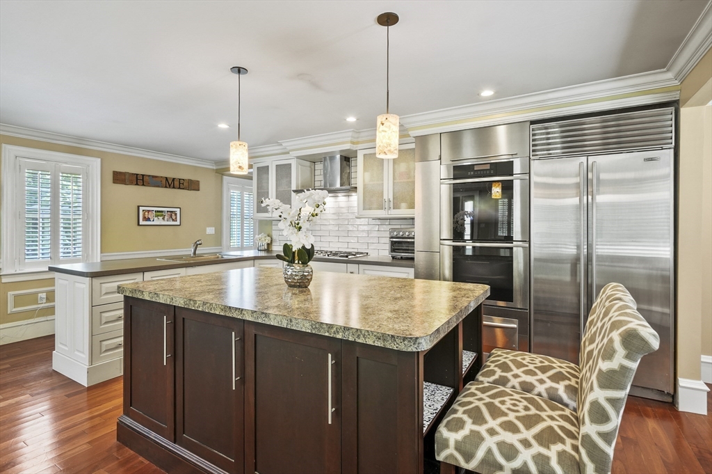 153 Sherbert Road Ashburnham, MA 01430 - Photo 8 of 32 a kitchen with center island table and chairs
