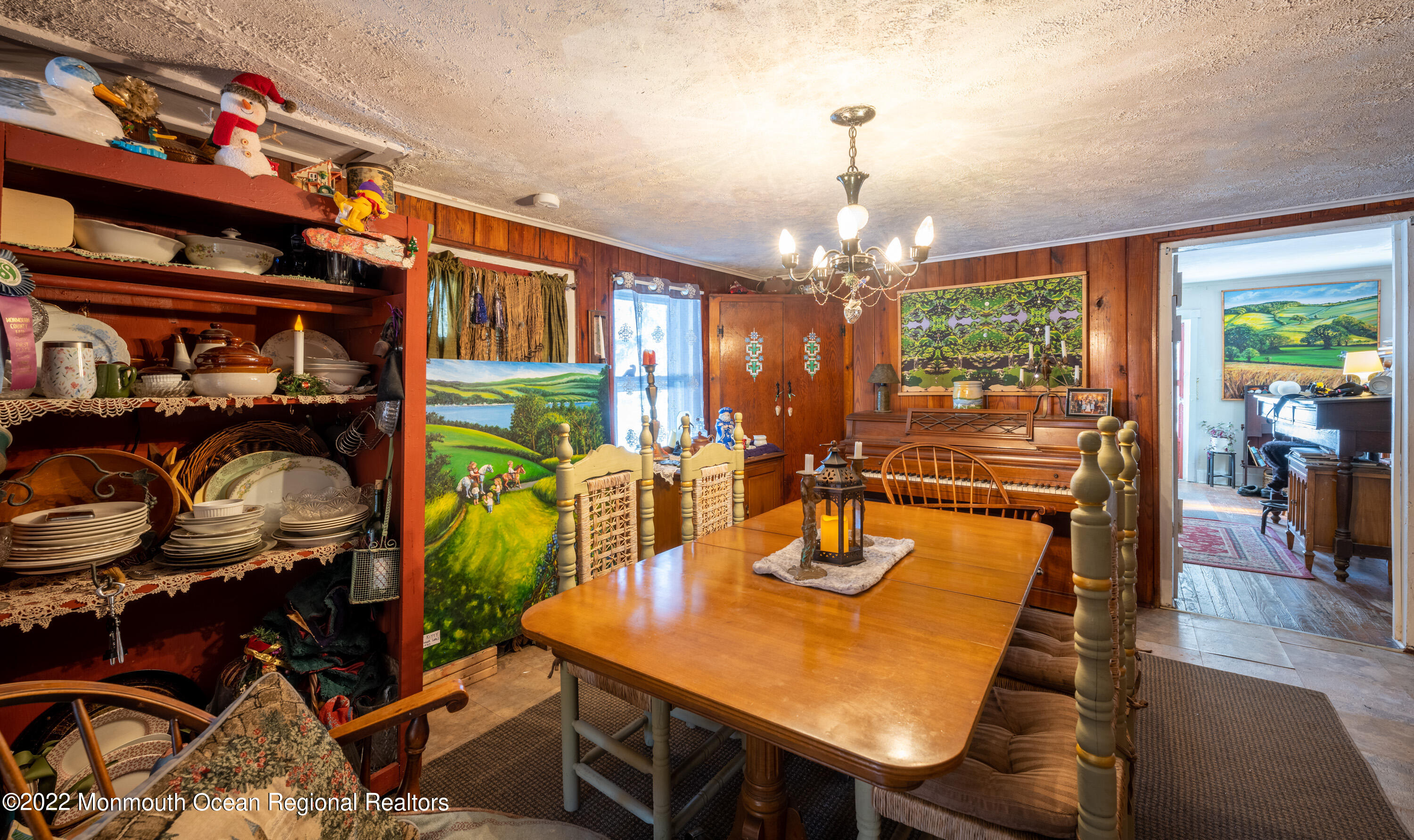 295 Newtons Corner Road Howell, NJ 07731 - Photo 13 of 42 a view of a dining room with furniture a chandelier and wooden floor