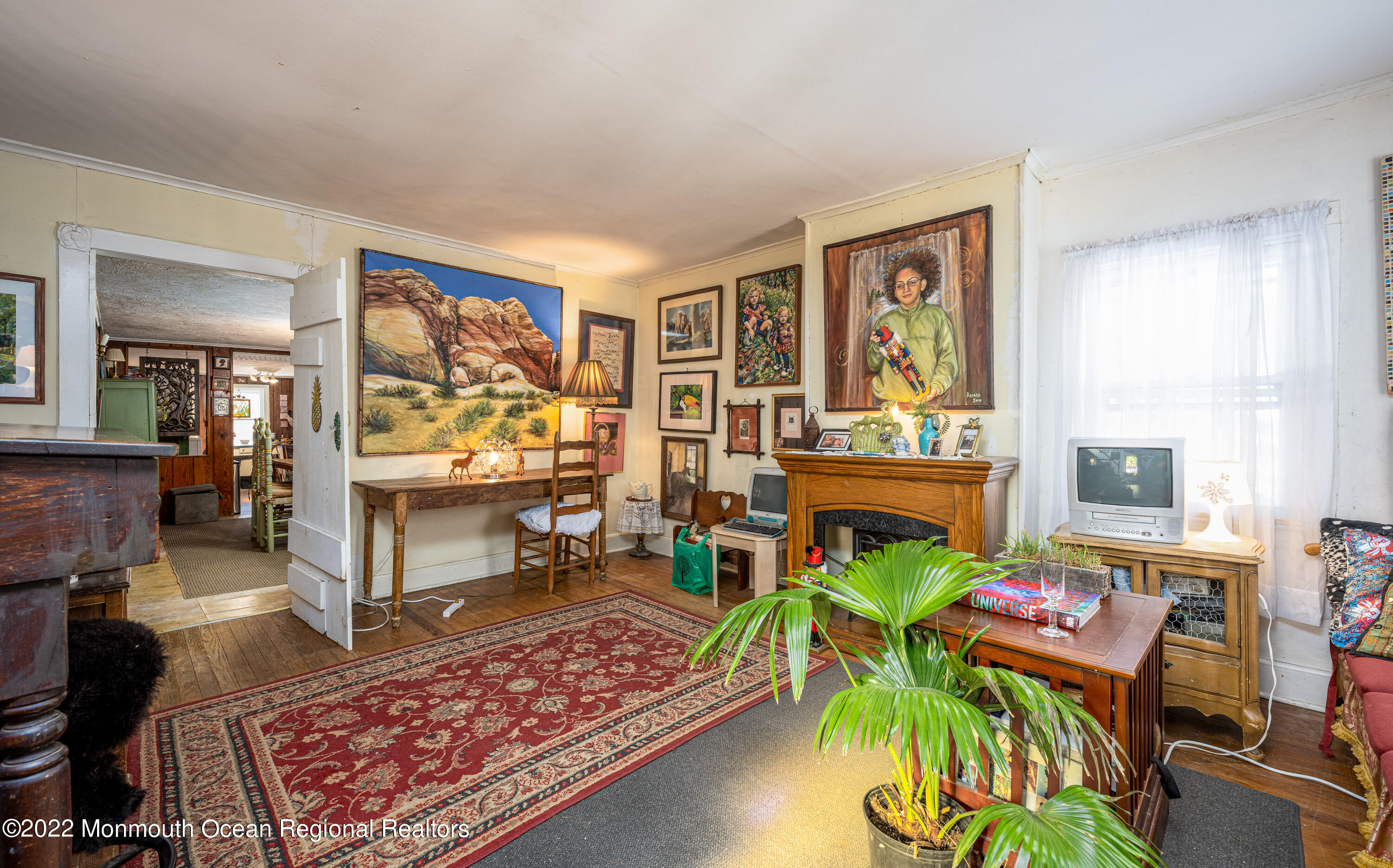 295 Newtons Corner Road Howell, NJ 07731 - Photo 19 of 42 a living room filled with furniture and a rug