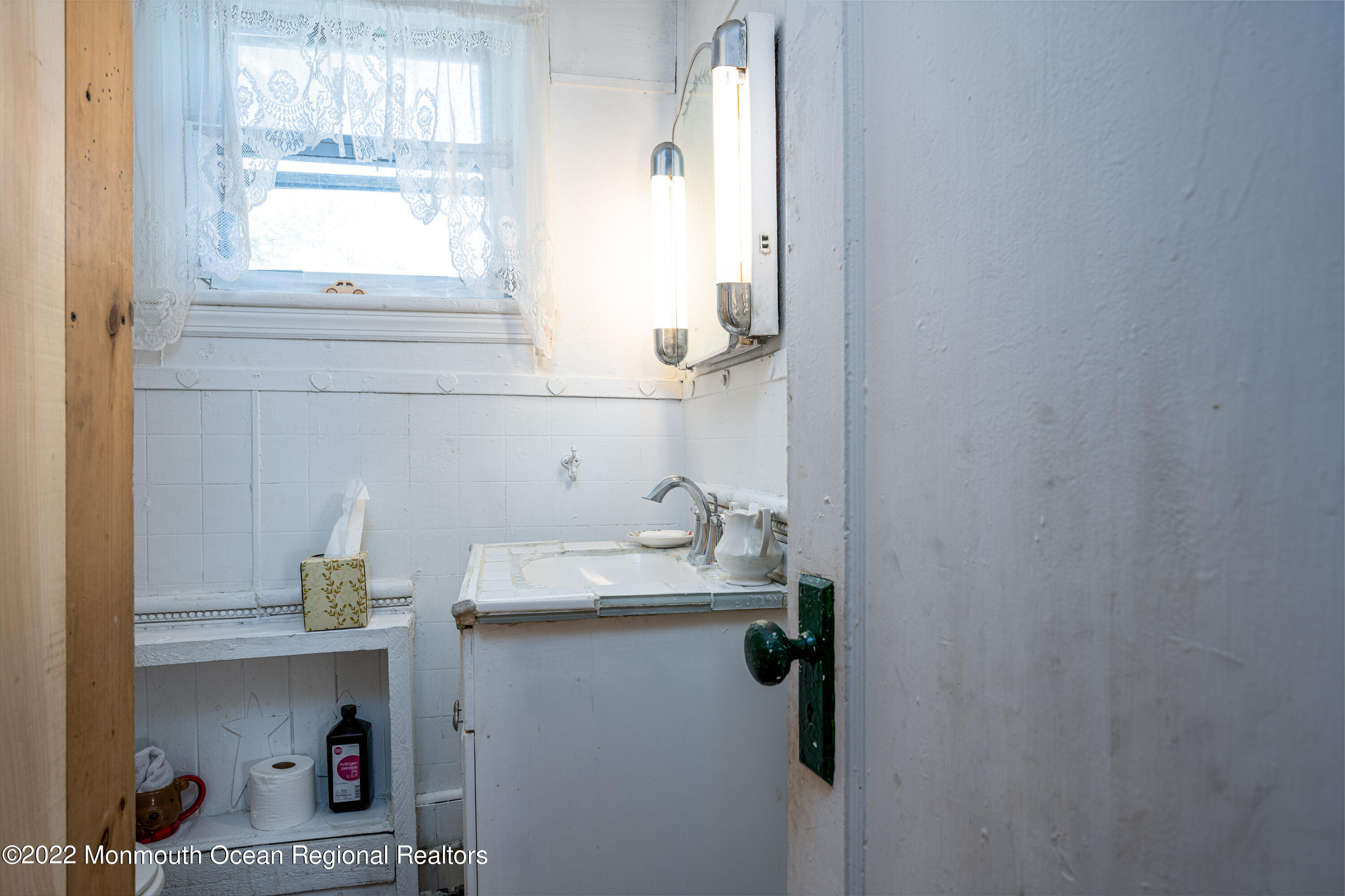 295 Newtons Corner Road Howell, NJ 07731 - Photo 23 of 42 a bathroom with a sink and a window