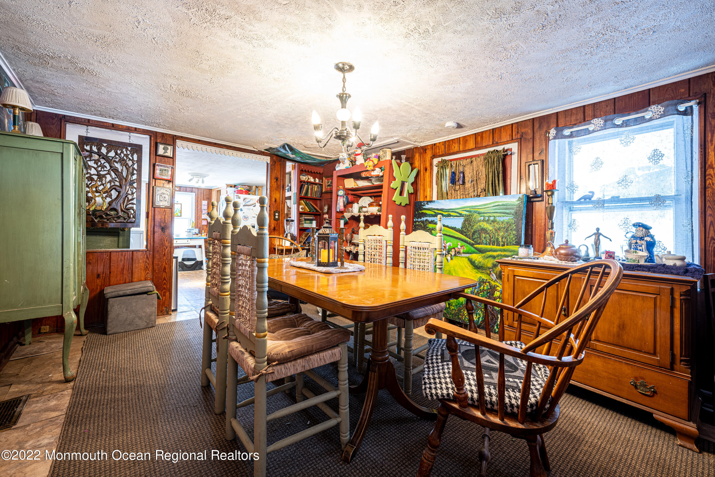 295 Newtons Corner Road Howell, NJ 07731 - Photo 3 of 42 a living room with furniture a dining table and chairs with wooden floor