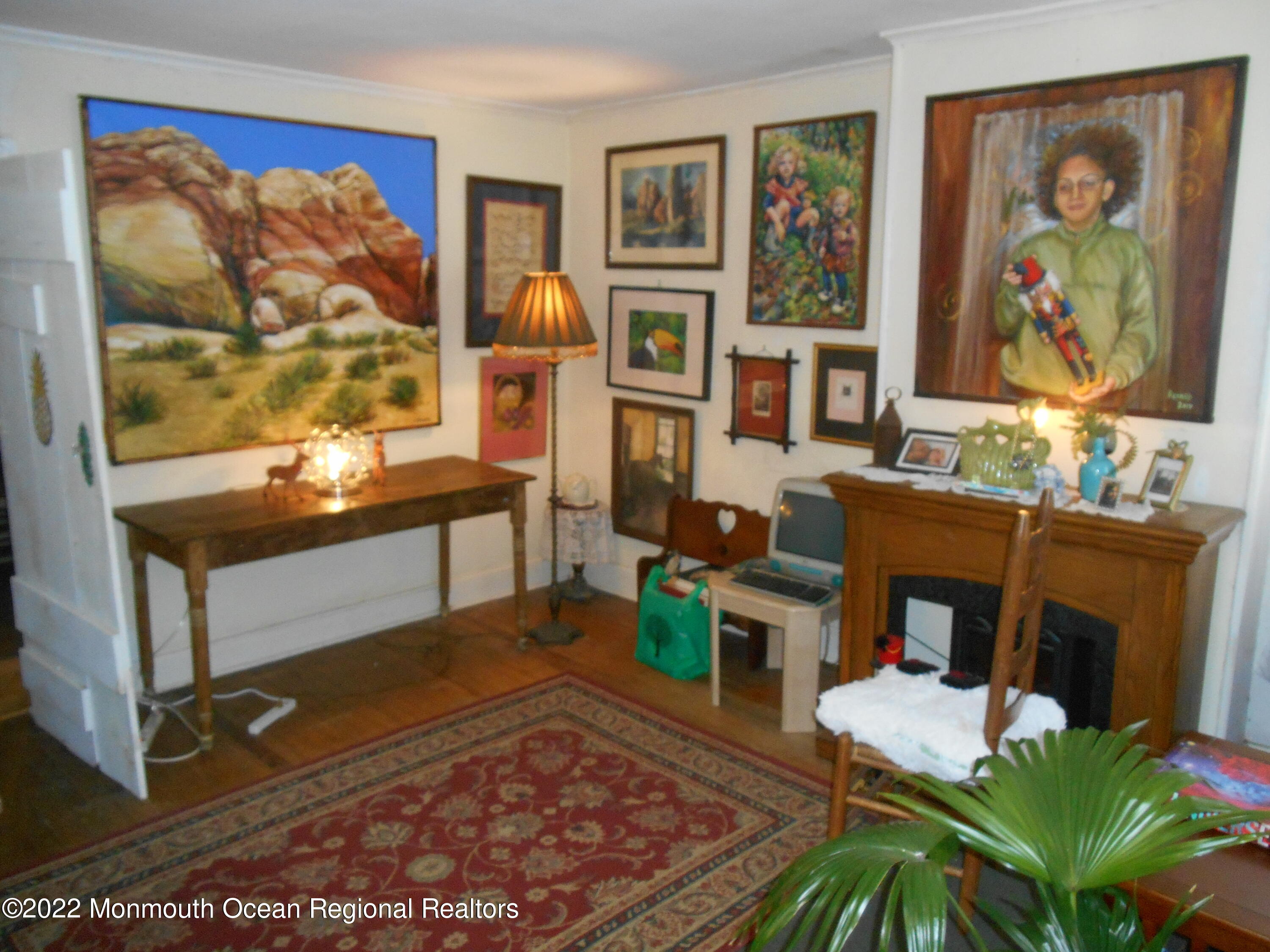 295 Newtons Corner Road Howell, NJ 07731 - Photo 35 of 42 a living room with furniture fireplace and rug