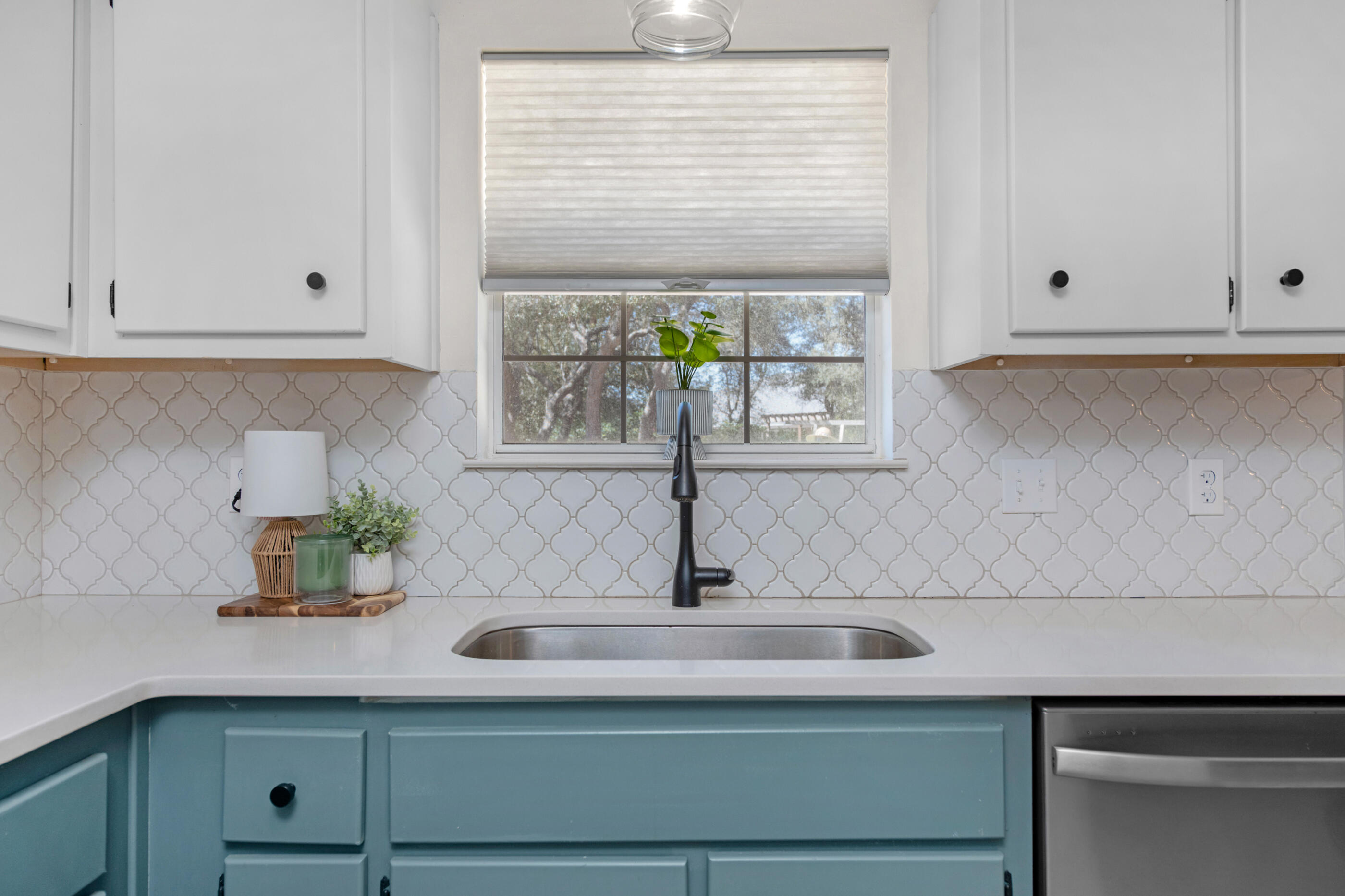 2709 Augustus Road Navarre, FL 32566 - Photo 17 of 46 a kitchen with a sink and cabinets