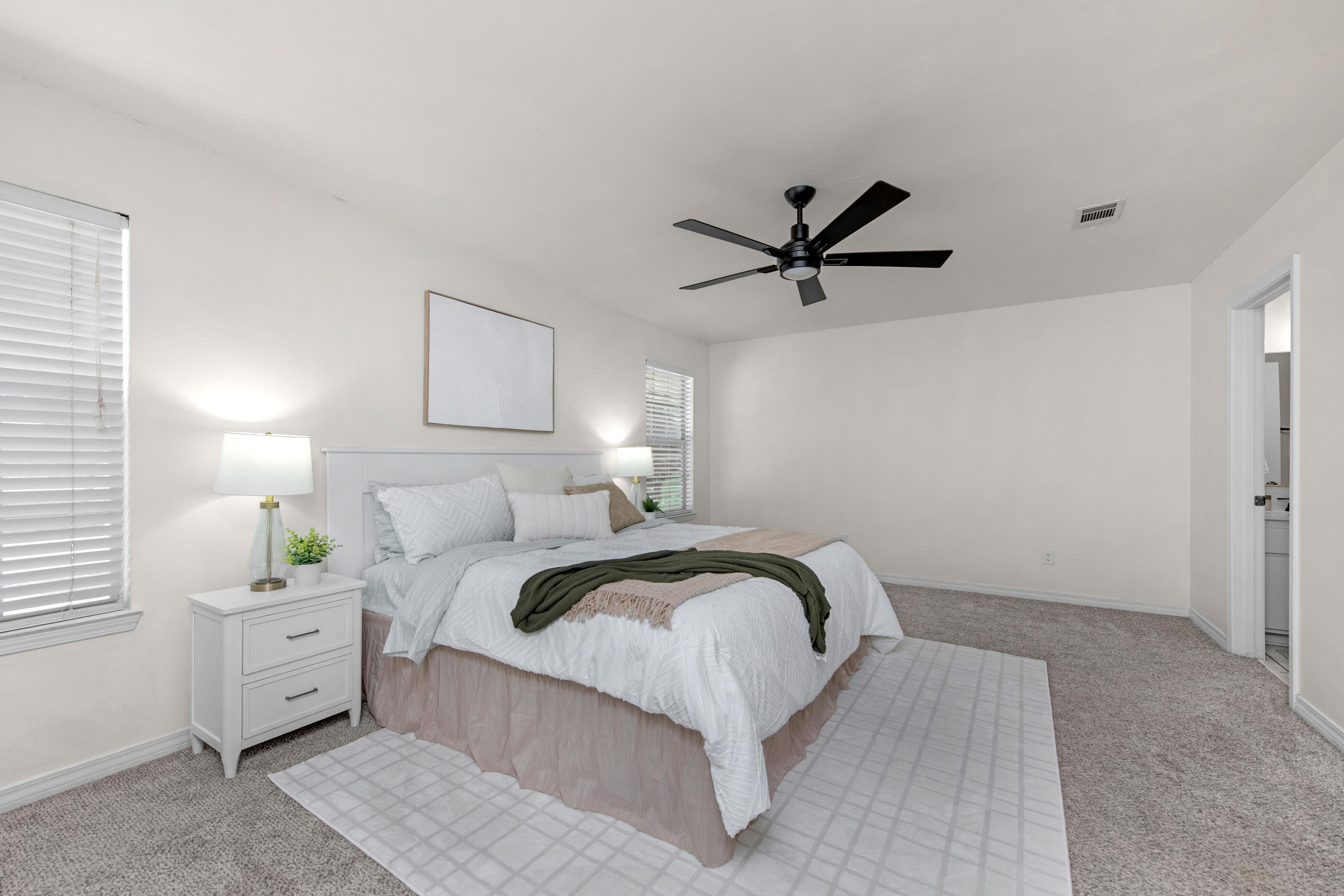 2709 Augustus Road Navarre, FL 32566 - Photo 26 of 46 a bedroom with a bed and a ceiling fan