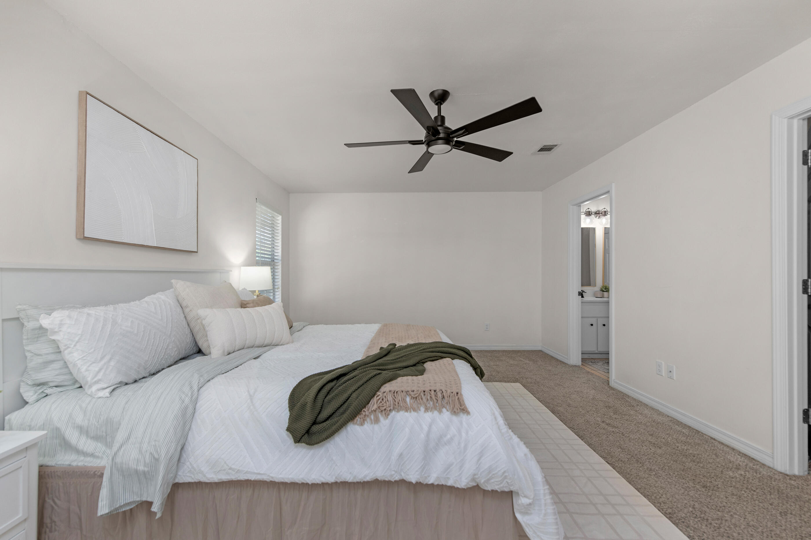 2709 Augustus Road Navarre, FL 32566 - Photo 27 of 46 a bedroom with a bed and a painting on the wall