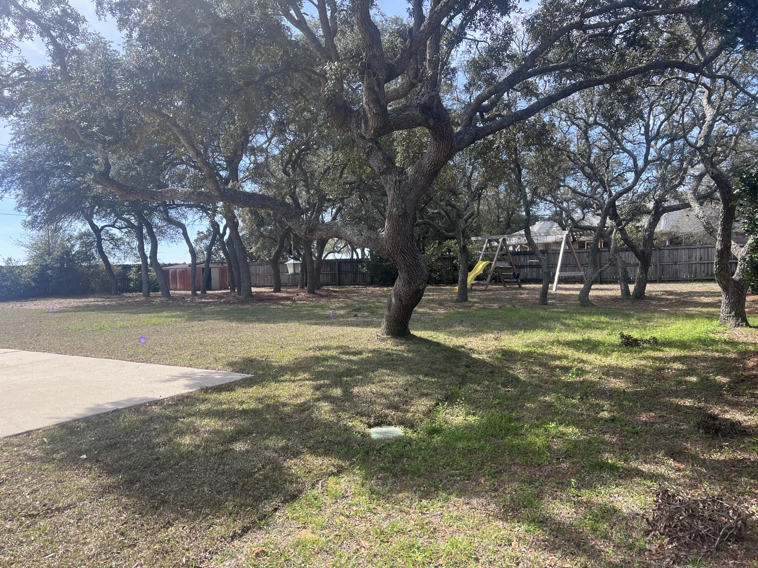 2709 Augustus Road Navarre, FL 32566 - Photo 3 of 46 a view of a park with tree s