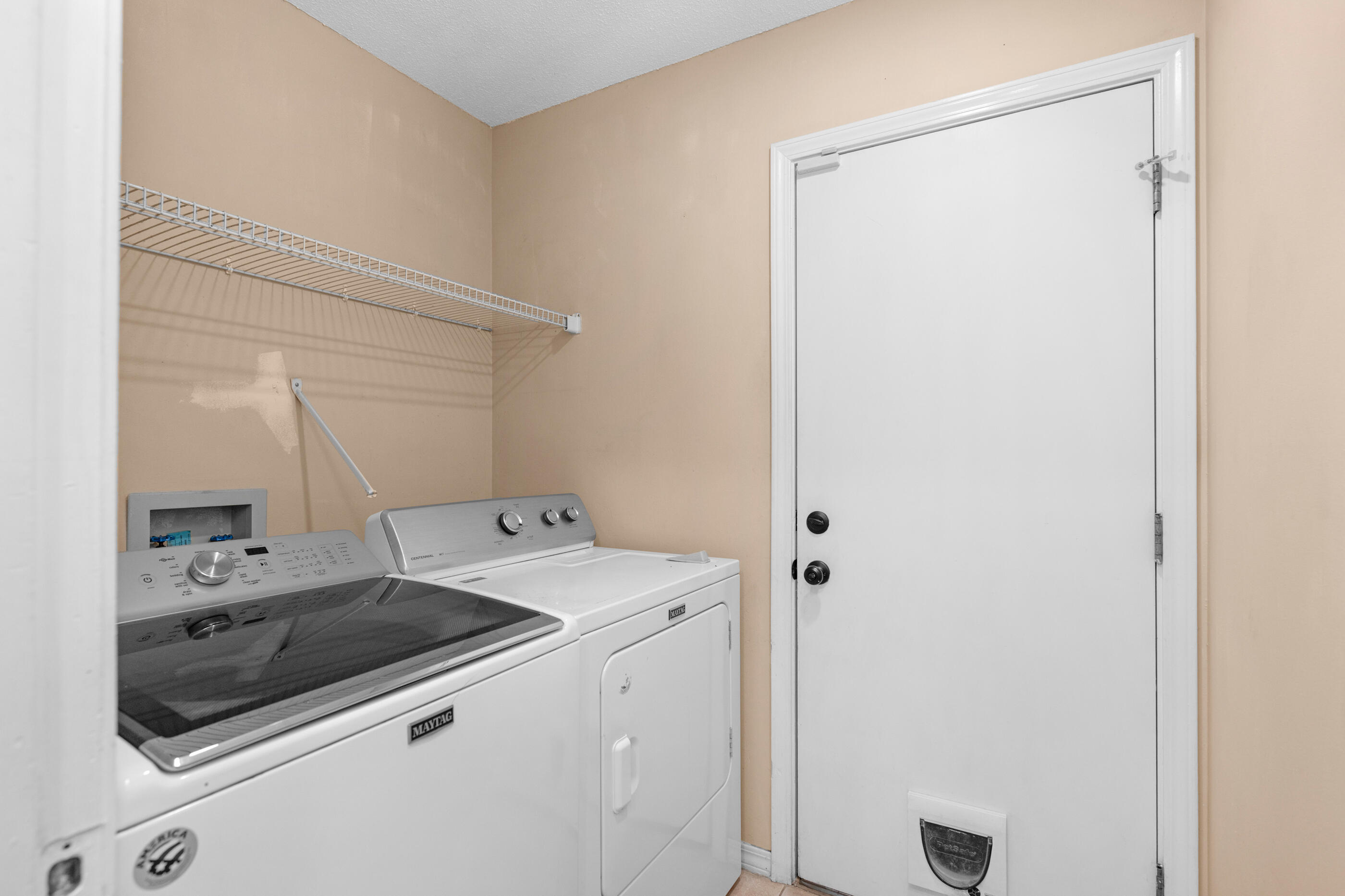 2709 Augustus Road Navarre, FL 32566 - Photo 31 of 46 a utility room with dryer and washer