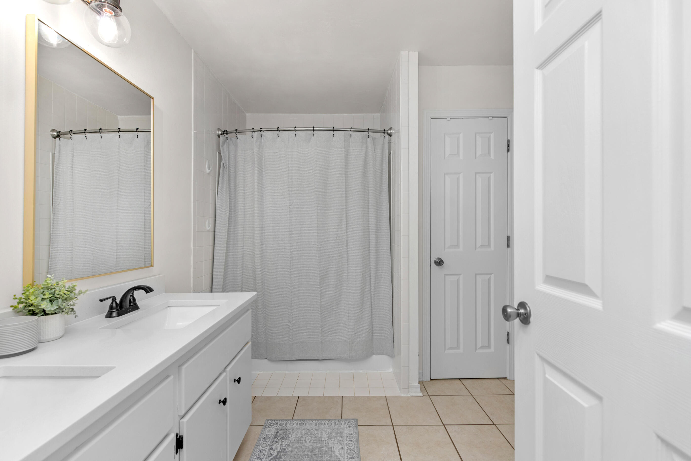 2709 Augustus Road Navarre, FL 32566 - Photo 34 of 46 a bathroom with a sink and shower