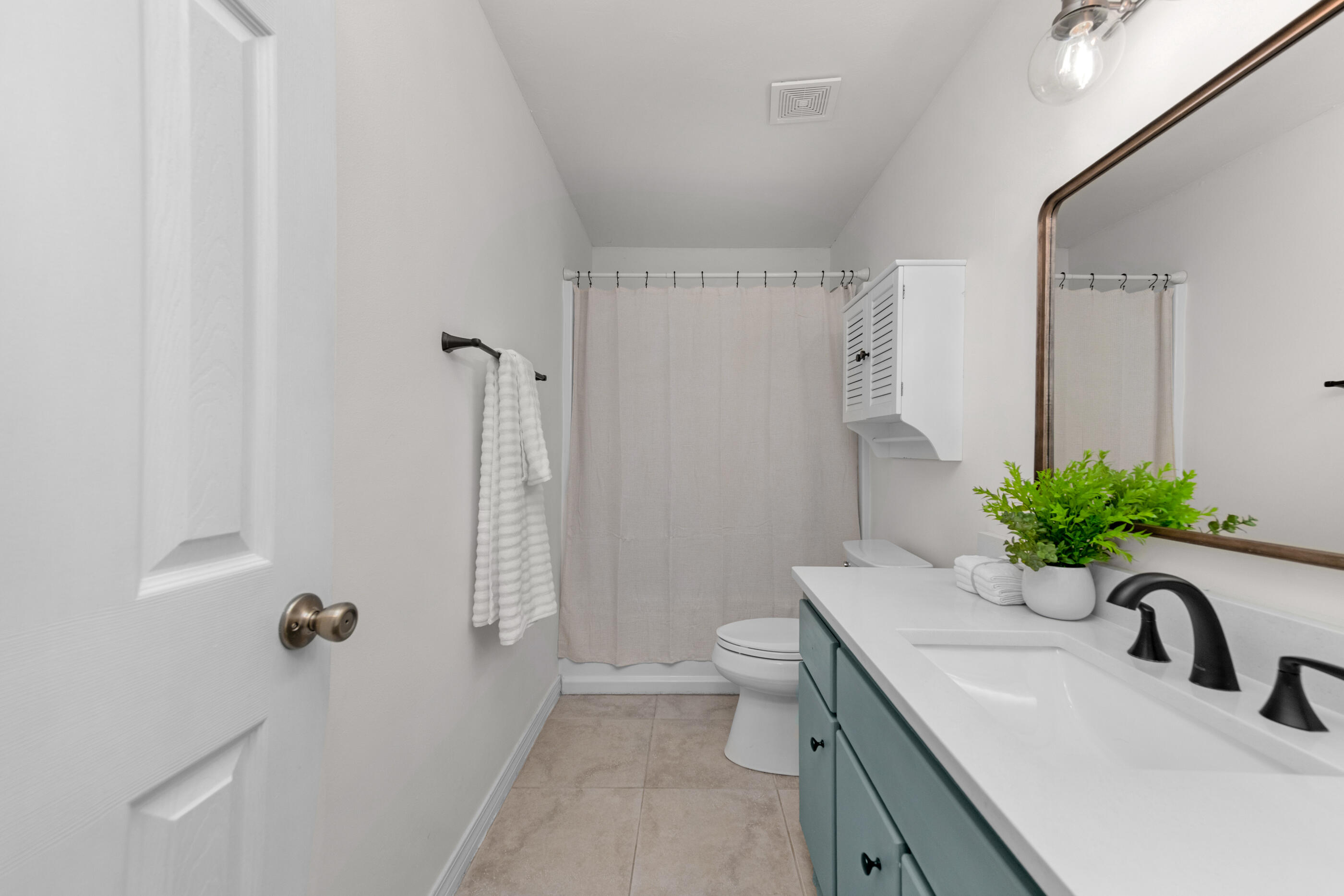 2709 Augustus Road Navarre, FL 32566 - Photo 38 of 46 a bathroom with a granite countertop sink a toilet and a tub