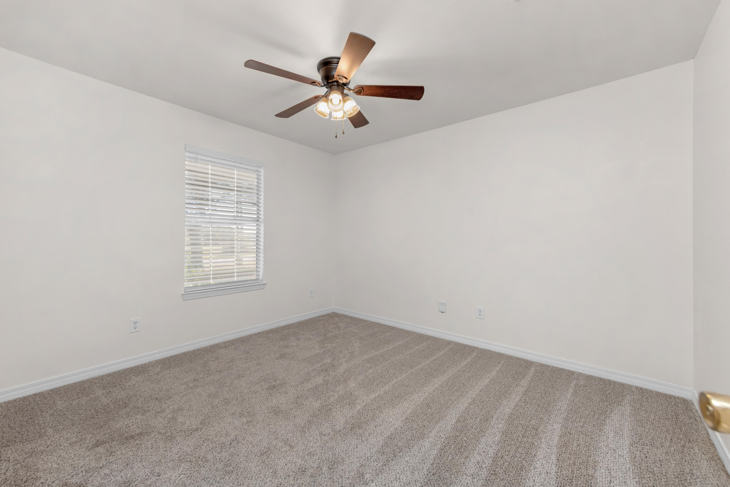 2709 Augustus Road Navarre, FL 32566 - Photo 41 of 46 an empty room with windows and fan