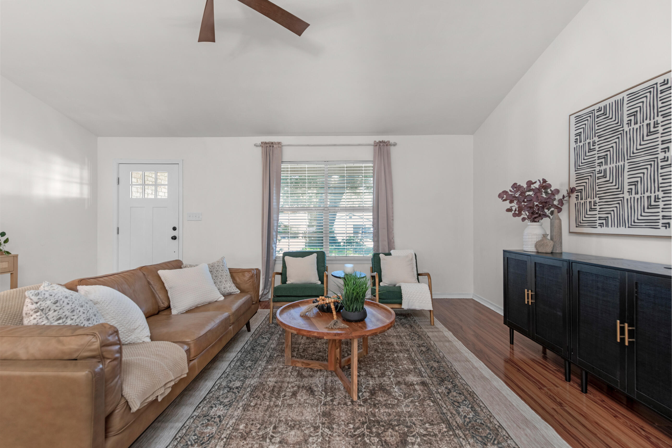 2709 Augustus Road Navarre, FL 32566 - Photo 5 of 46 a living room with furniture and wooden floor